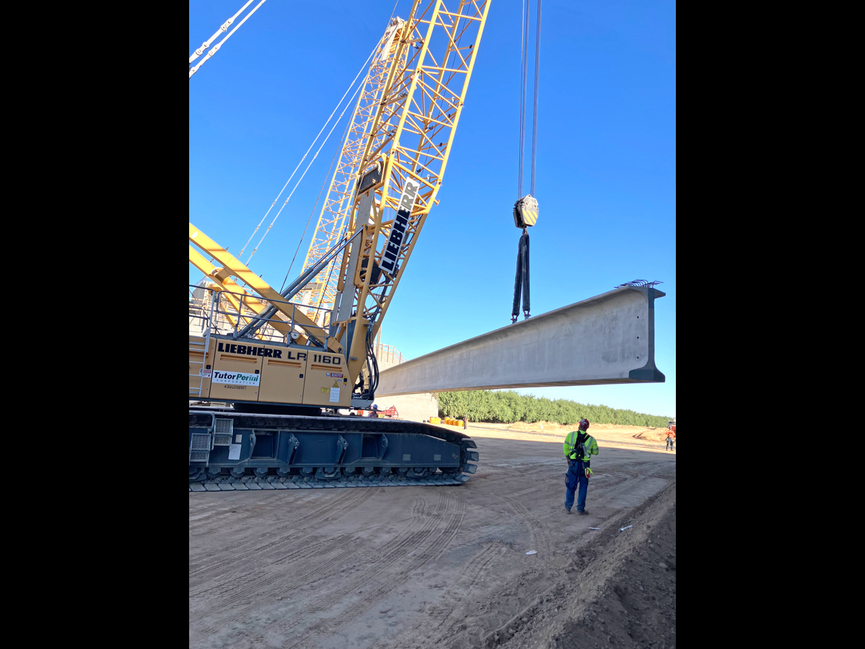 Crews from Tutor-Perini/Zachry/Parsons Joint Venture placing pre-cast girders at the Avenue 9 Grade Separation in Fresno County. Each girder spanned 172-feet long, is 7 feet tall and weighed more than 210,100 pounds. This is the first four of nine girders to be placed at the Avenue 9 overcrossing.